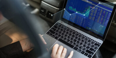 Businessman checking the stock market from a laptop